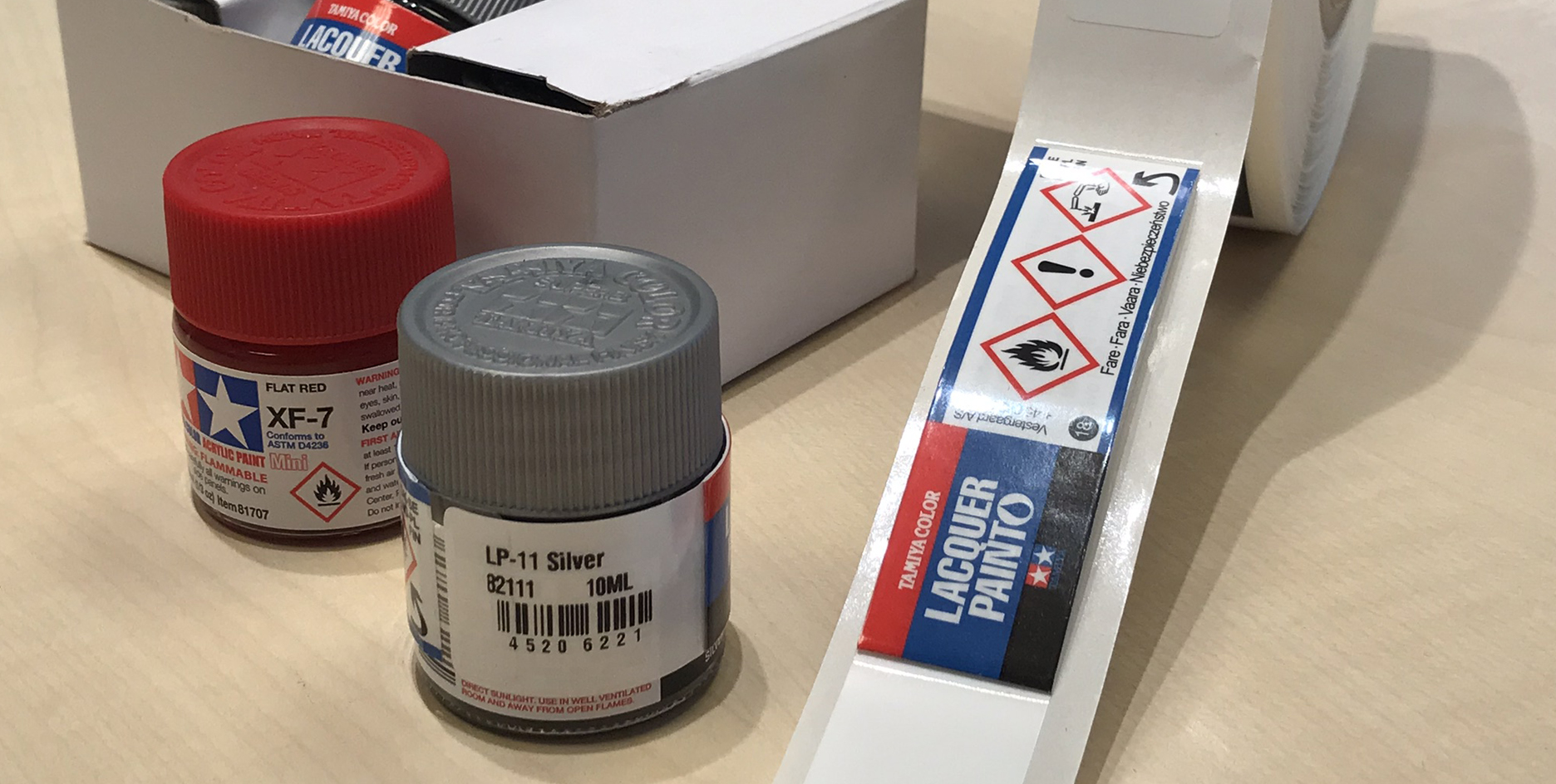 How do I apply the label on a cylindrical, small container